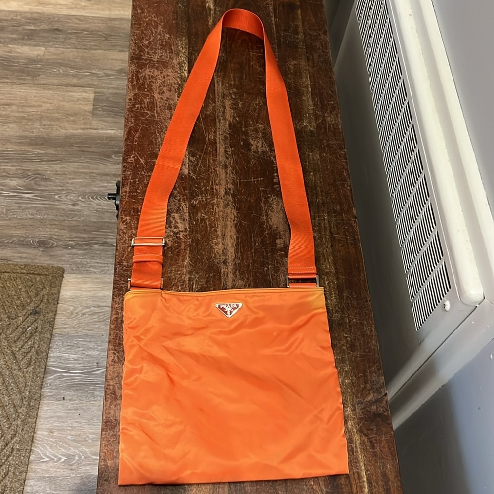 Orange fun Prada purse for summer